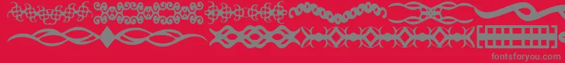 ScDividers-fontti – harmaat kirjasimet punaisella taustalla