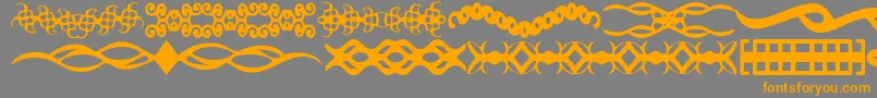 フォントScDividers – オレンジの文字は灰色の背景にあります。