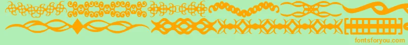 Czcionka ScDividers – pomarańczowe czcionki na zielonym tle
