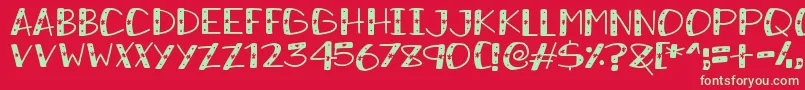 SnowySparkles-Schriftart – Grüne Schriften auf rotem Hintergrund