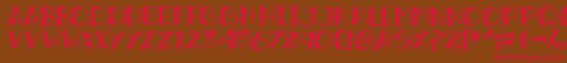 フォントSnowySparkles – 赤い文字が茶色の背景にあります。