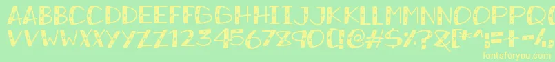 フォントSnowySparkles – 黄色の文字が緑の背景にあります