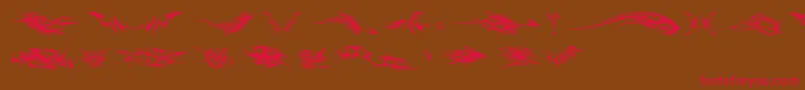TribalzByMarioz Font – Red Fonts on Brown Background