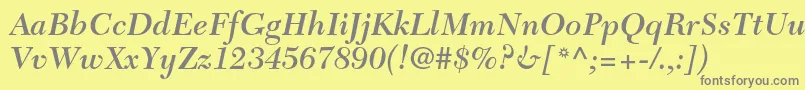 フォントNewcaledonialtstdSemibdit – 黄色の背景に灰色の文字
