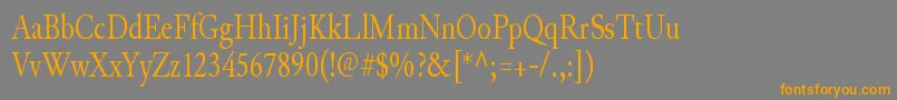 フォントJunicodeRegularcondensed – オレンジの文字は灰色の背景にあります。