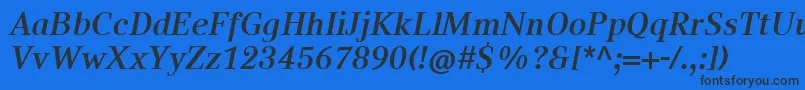 Czcionka CompatilTextLtComBoldItalic – czarne czcionki na niebieskim tle