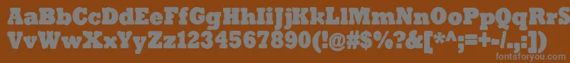 TenderGoliath-Schriftart – Graue Schriften auf braunem Hintergrund