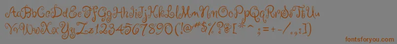 RugeBoogie-Schriftart – Braune Schriften auf grauem Hintergrund