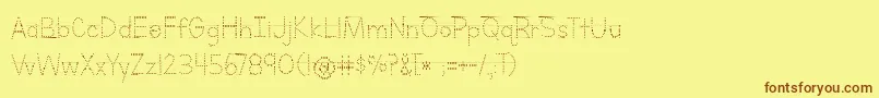 フォントBmdLettersForLearnersLinedDots – 茶色の文字が黄色の背景にあります。