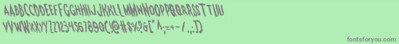フォントMonsteramaleft – 緑の背景に灰色の文字