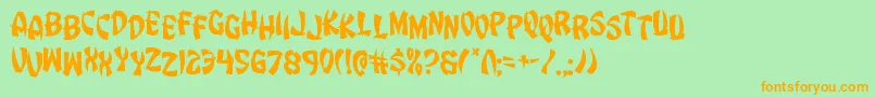 フォントEggrolljumble – オレンジの文字が緑の背景にあります。