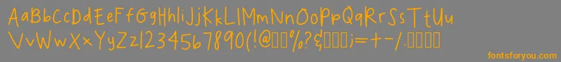 フォントSpookydeeeHandwritingRegular – オレンジの文字は灰色の背景にあります。