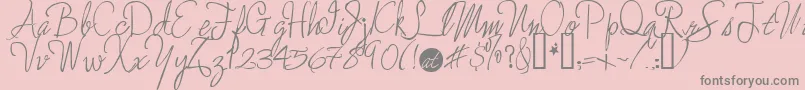 フォントEnchanted ffy – ピンクの背景に灰色の文字