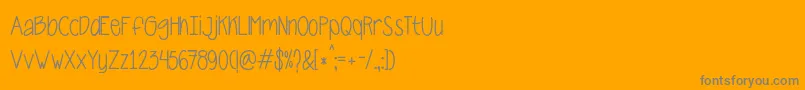 CarnalaBeta-Schriftart – Graue Schriften auf orangefarbenem Hintergrund