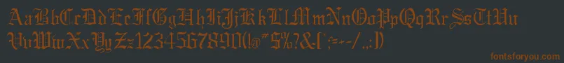 GregorianRegularDb-fontti – ruskeat fontit mustalla taustalla