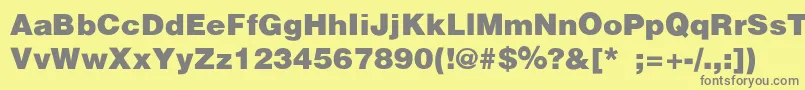 HelveticaBlackSemibold-fontti – harmaat kirjasimet keltaisella taustalla