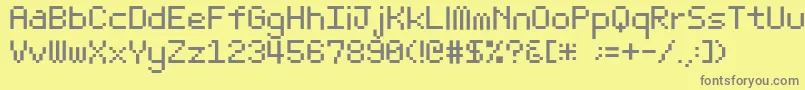 フォントBit Light10 Srb – 黄色の背景に灰色の文字