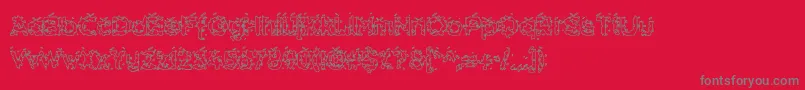 HammeroidHollow-fontti – harmaat kirjasimet punaisella taustalla