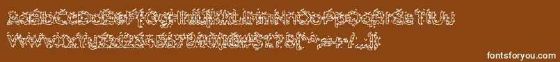 HammeroidHollow-fontti – valkoiset fontit ruskealla taustalla