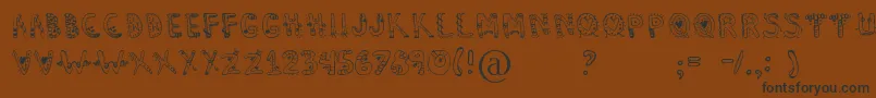 Dennealiens Font – Black Fonts on Brown Background