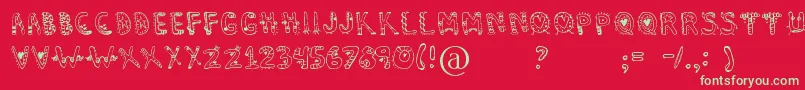 Dennealiens Font – Green Fonts on Red Background