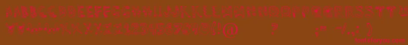 Dennealiens Font – Red Fonts on Brown Background