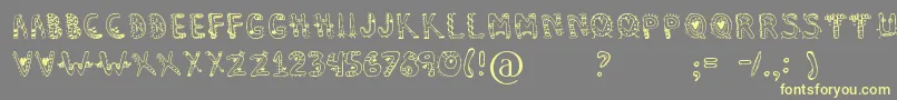 Dennealiens Font – Yellow Fonts on Gray Background