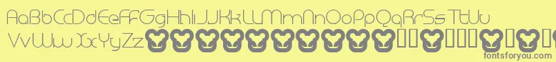 MegalomaniaNormal-fontti – harmaat kirjasimet keltaisella taustalla