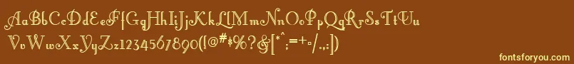 ArtemisDeco-fontti – keltaiset fontit ruskealla taustalla