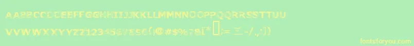 フォントFonttoachainsaw – 黄色の文字が緑の背景にあります
