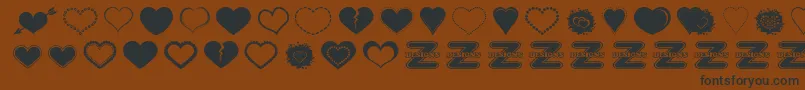 SexyLoveHearts2 Font – Black Fonts on Brown Background