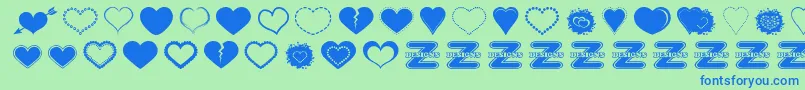 SexyLoveHearts2-Schriftart – Blaue Schriften auf grünem Hintergrund