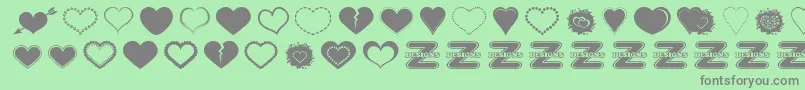 SexyLoveHearts2-Schriftart – Graue Schriften auf grünem Hintergrund