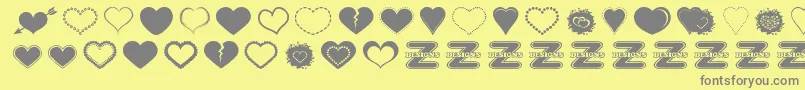 SexyLoveHearts2-Schriftart – Graue Schriften auf gelbem Hintergrund