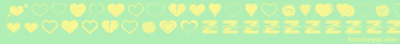 SexyLoveHearts2-Schriftart – Gelbe Schriften auf grünem Hintergrund