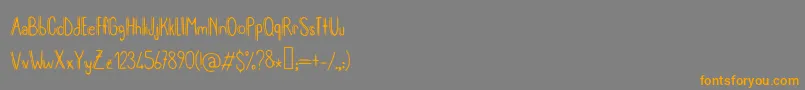MeryjaneV2-Schriftart – Orangefarbene Schriften auf grauem Hintergrund