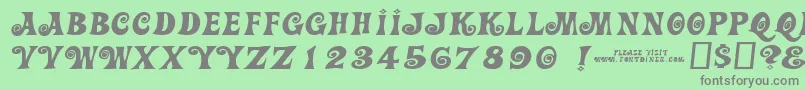 フォントActioniswiderjl – 緑の背景に灰色の文字