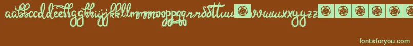 フォントHoobie – 緑色の文字が茶色の背景にあります。
