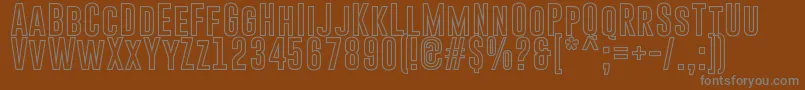 GoboldHollowBold-fontti – harmaat kirjasimet ruskealla taustalla