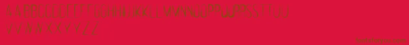 Czcionka FeralRegular – brązowe czcionki na czerwonym tle