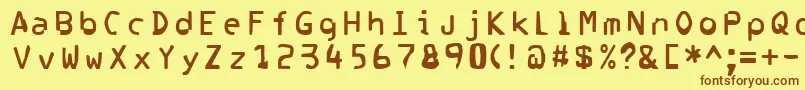 フォントCorrupter – 茶色の文字が黄色の背景にあります。