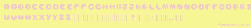 PacmanicRegular-fontti – vaaleanpunaiset fontit keltaisella taustalla