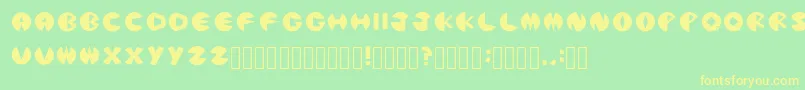 PacmanicRegular Font – Yellow Fonts on Green Background