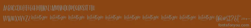 VayenthaSans Font – Gray Fonts on Brown Background