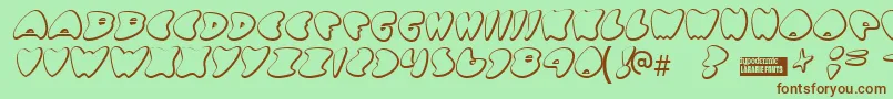 Gotnohea-fontti – ruskeat fontit vihreällä taustalla