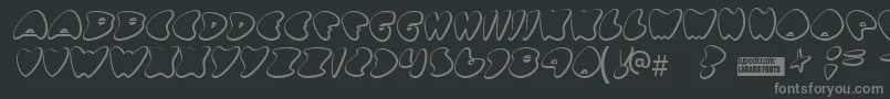 Gotnohea-fontti – harmaat kirjasimet mustalla taustalla