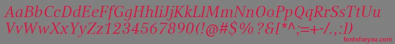 フォントCompatilTextLtComItalic – 赤い文字の灰色の背景