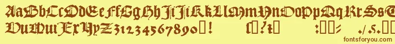 フォント1492QuadrataLim – 茶色の文字が黄色の背景にあります。