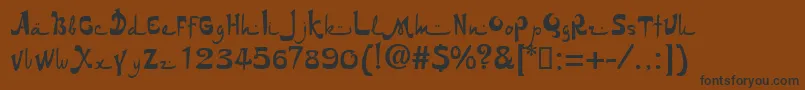 Nuria.Kz Font – Black Fonts on Brown Background