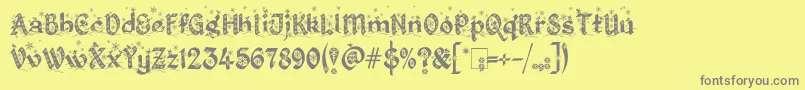Fonte KingthingsChristmas2.2 – fontes cinzas em um fundo amarelo